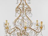 a brass and crystal chandelier with five lights