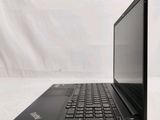 the back of a black laptop computer sitting on top of a white surface