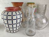many different vases and glasses on the table