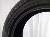 a close up of a tire on a white surface