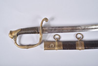 an image of a close up of a sword on a white surface