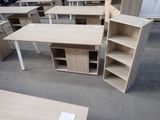 a lot of desks and shelves in a room