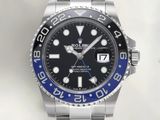 a rolex watch with a blue bezel on the bracelet