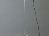 the floor lamp has three lights on each side of it