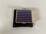 an image of a lapel pin with blue and gold stripes