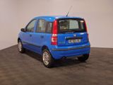 a small blue car that is parked in a room