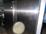 an image of a stainless steel refrigerator in a kitchen