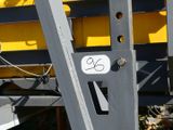 a close up of a yellow and black train on the tracks