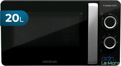 Le four à micro-ondes est noir et comporte un autocollant bleu.