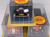 three toy cars that are in a display case