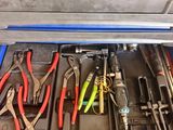 many tools in a tool box on the table