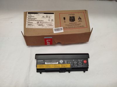 a box and a battery on a white surface