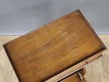 an image of a small wooden table with a drawer underneath it