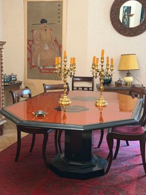 a dining room with a table and chairs in it