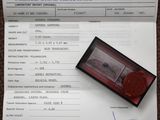 a certificate with a red wax stamp on top of it