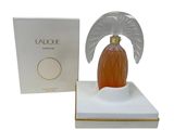 the perfume bottle is in a white box with an angel wings on it