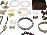 many different types of jewelry on the table together