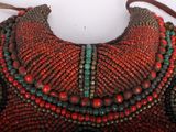 an image of a close up of a purse with beads on it