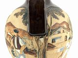 a brown vase with a painting on it on a white surface