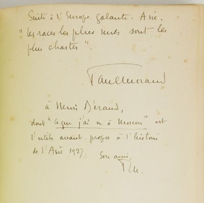 an old book with writing on it sitting on a table