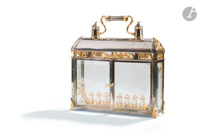 a glass box with a gold handle on a white background