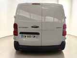 a white van that is parked in a room