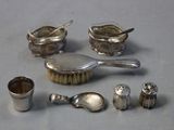 a lot of silver items that are on a table
