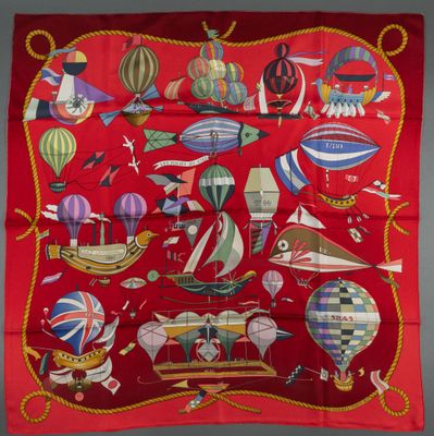 an image of a red scarf with many different types of hot air balloons