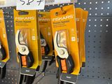 many different types of pliers on display in a store
