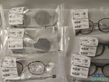 a lot of glasses that are sitting on a table