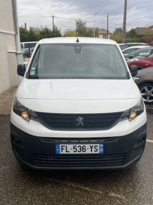 the white van is parked in the parking lot next to other cars