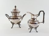 pair of antique silver plated teapots with handles and handles