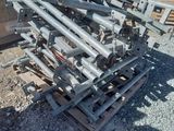 a pile of metal pipes sitting on a pallet