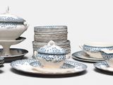 a lot of plates and cups on the table