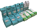 several packs of baby diapers are lined up on a white background