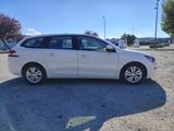 a picture of a white car parked in a parking lot