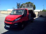 a red van that is parked in a parking lot