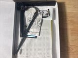 a box with a pen, glasses, and a book on it
