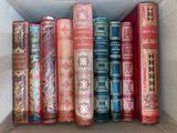 a box full of old books sitting on a table