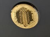 a close up of a coin on a black surface