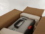 a suitcase in a box with a handle in it