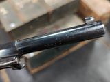 a gun that is sitting on a table in a room