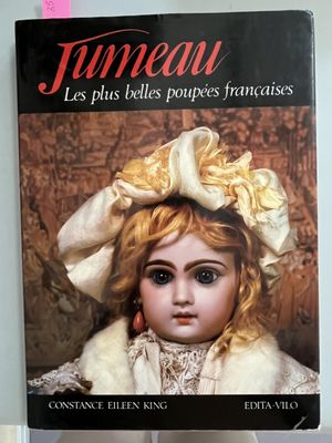 a book with a picture of a doll on it