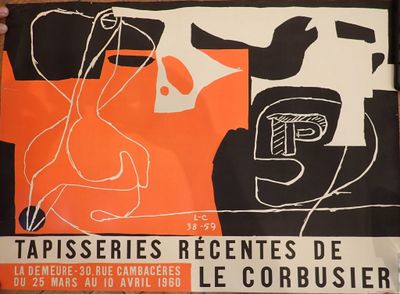 a man holding up a poster with a drawing on it