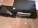 a remote control sitting on top of a black box