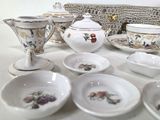a table with a variety of dishes and cups on it