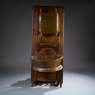 a tall wooden cabinet with a mirror on top of it