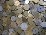 a lot of coins that are sitting on a table