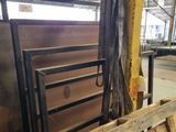 several pallets of wood are stacked up in a warehouse