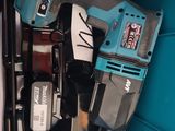 two electric tools in a blue box on a table